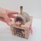 a handmade 1/12th scale miniature clay and brick pizza oven or dolls houses and miniature application. 